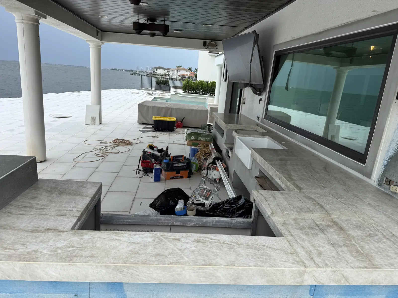 Outdoor kitchen bar top overlooking the water installed by Venet LLC in Tampa Bay, Florida