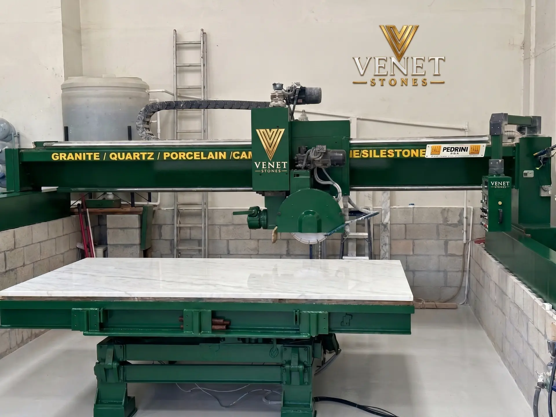 Stone slab fabrication on a bridge saw inside the Venet Stones workshop