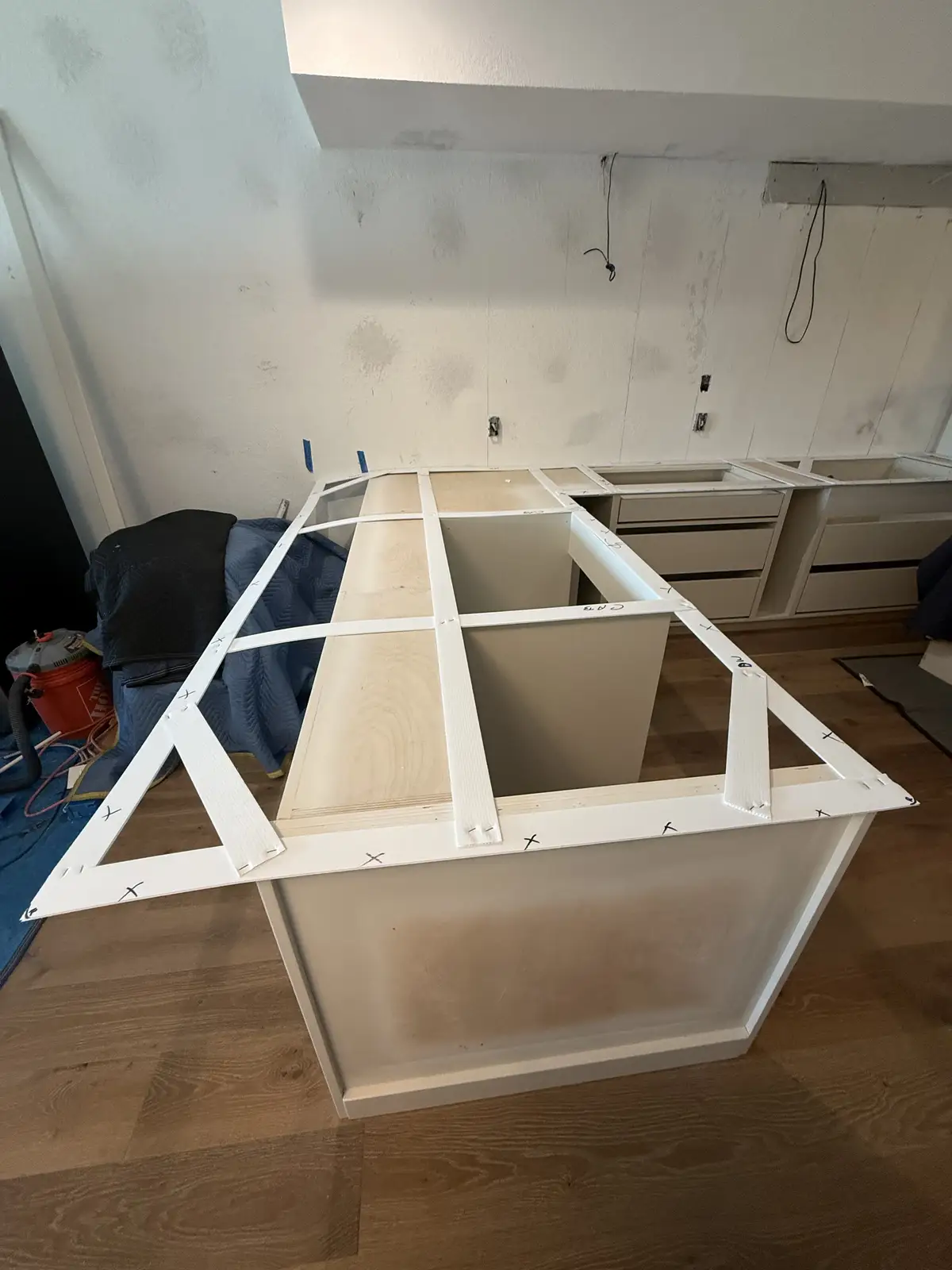 Kitchen island base cabinetry under construction by Venet LLC in Tampa Bay, Florida