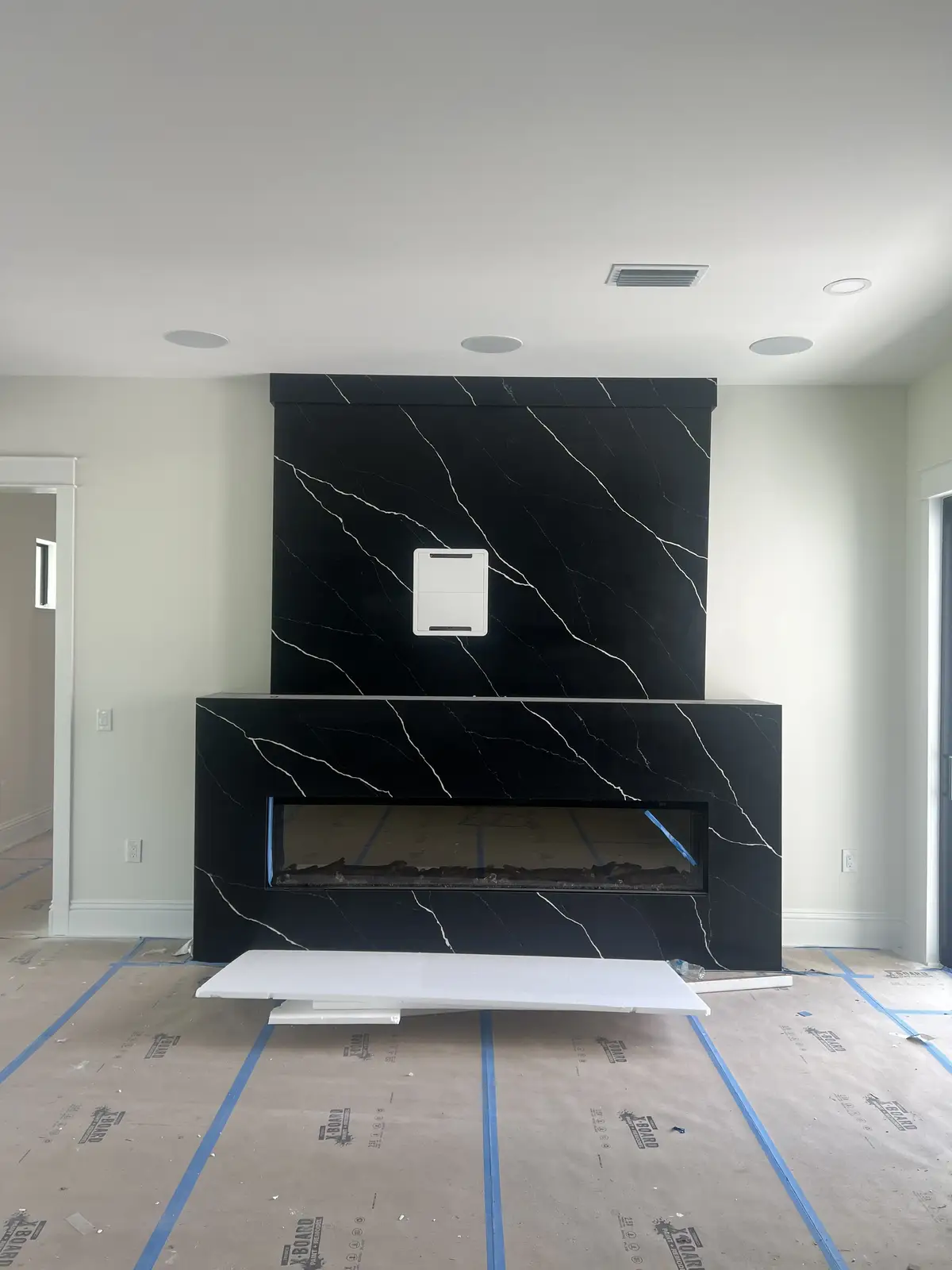 Black marble linear fireplace surround by Venet LLC in Tampa Bay, Florida